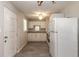Functional kitchen features white cabinetry, modern floors, and bright natural light at 1117 Berkshire Rd, Daytona Beach, FL 32117