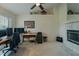 Bright office space with vaulted ceilings, a fireplace, and a large window at 1120 Caldwell Ave, Orange City, FL 32763