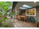 Covered back porch with skylights, ceiling fans and an outdoor dining table at 120 Beach St, Ponce Inlet, FL 32127
