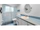 Bathroom with a blue countertop, tiled floor, and enclosed shower at 120 Beach St, Ponce Inlet, FL 32127