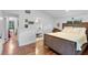 Bedroom with wood floors, natural light, and a private ensuite bathroom at 120 Beach St, Ponce Inlet, FL 32127