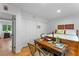 Bedroom with a desk, bed, closet and hardwood floors at 120 Beach St, Ponce Inlet, FL 32127