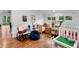 Spacious playroom with hardwood floors, lots of windows, toys and ample storage at 120 Beach St, Ponce Inlet, FL 32127