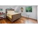 Bedroom with wood floors, natural light, and neutral walls at 120 Beach St, Ponce Inlet, FL 32127