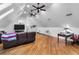 Bonus room with a couch, office desk and chair, and three ceiling fans at 120 Beach St, Ponce Inlet, FL 32127