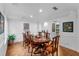 Charming dining room featuring an oval table, wooden chairs, and hardwood floors at 120 Beach St, Ponce Inlet, FL 32127