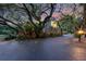 Secluded home with mature trees and well-maintained landscaping creating a private and serene atmosphere at 120 Beach St, Ponce Inlet, FL 32127