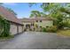 Charming two-story home with a two-car garage and lush landscaping at 120 Beach St, Ponce Inlet, FL 32127