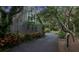 Secluded home with mature trees and well-maintained landscaping creating a private and serene atmosphere at 120 Beach St, Ponce Inlet, FL 32127