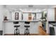 Bright kitchen with hardwood floors, breakfast bar, stainless steel appliances, and natural light at 120 Beach St, Ponce Inlet, FL 32127