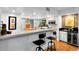 Open kitchen with breakfast bar, modern appliances, and ample counter space at 120 Beach St, Ponce Inlet, FL 32127