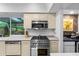 Bright kitchen with stainless steel appliances, and natural light at 120 Beach St, Ponce Inlet, FL 32127