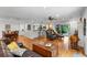Inviting living area with a breakfast bar, dining area, and access to the lanai at 120 Beach St, Ponce Inlet, FL 32127