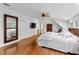Bright main bedroom with wood floors, lots of light, large closet, and ensuite bathroom at 120 Beach St, Ponce Inlet, FL 32127