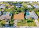 Aerial view of the property showcasing the home, landscaping, and neighborhood at 1216 Sunland Rd, Daytona Beach, FL 32114