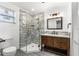 Stylish bathroom featuring tile shower and wood vanity at 1216 Sunland Rd, Daytona Beach, FL 32114