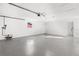 Spacious garage featuring durable flooring, a convenient window, and ample storage space at 1216 Sunland Rd, Daytona Beach, FL 32114