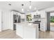 Modern kitchen features quartz countertops, stainless appliances, and a functional island at 1216 Sunland Rd, Daytona Beach, FL 32114