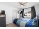 Bedroom with modern gray accents, natural light, and light wood-look flooring at 1268 Bel Aire Dr, Daytona Beach, FL 32118