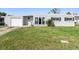 Charming single-story home featuring a well-maintained lawn and an attached one-car garage at 1268 Bel Aire Dr, Daytona Beach, FL 32118