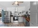 Well-lit kitchen features stainless steel appliances, light gray cabinets, and beautiful wooden countertops at 1268 Bel Aire Dr, Daytona Beach, FL 32118