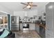 Beautiful kitchen with stainless steel appliances, stylish backsplash, wood countertops and gray cabinetry at 1268 Bel Aire Dr, Daytona Beach, FL 32118