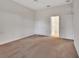 Neutral bedroom with carpet and an open door leading to an en suite bathroom at 1429 Carlow Cir, Ormond Beach, FL 32174