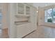Dining area featuring built-in cabinetry and large window at 1429 Carlow Cir, Ormond Beach, FL 32174