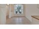 Bright dining area featuring tile flooring and a large window at 1429 Carlow Cir, Ormond Beach, FL 32174