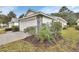 Beautiful home exterior shows the garage, stone accents, and landscaping at 1429 Carlow Cir, Ormond Beach, FL 32174