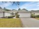 Charming one-story home featuring a two-car garage and well-maintained landscaping at 1429 Carlow Cir, Ormond Beach, FL 32174