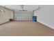 Spacious two car garage with neutral paint and epoxy flooring at 1429 Carlow Cir, Ormond Beach, FL 32174