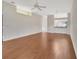 Spacious living room featuring wood floors and an open design leading to the kitchen at 1429 Carlow Cir, Ormond Beach, FL 32174