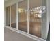 View of the interior of the home including the kitchen and living room from the patio at 1429 Carlow Cir, Ormond Beach, FL 32174