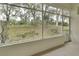 Spacious screened lanai with relaxing views of the natural backyard at 1429 Carlow Cir, Ormond Beach, FL 32174