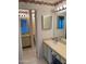 Bathroom featuring tiled floors, patterned shower curtain, and double sinks at 168 Olive Tree Cir # 168, Altamonte Springs, FL 32714