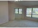 Bedroom with carpeted floors and many large windows offering view of the outdoors at 168 Olive Tree Cir # 168, Altamonte Springs, FL 32714
