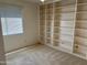 Bedroom with carpeted floors, large bookshelf, and window with natural light at 168 Olive Tree Cir # 168, Altamonte Springs, FL 32714