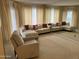 Bright living area with large windows, plush seating, and a large mirror that enhances the room's spaciousness at 168 Olive Tree Cir # 168, Altamonte Springs, FL 32714