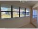 Living room features large windows with peaceful outdoor view and neutral walls at 168 Olive Tree Cir # 168, Altamonte Springs, FL 32714