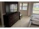 Spacious main bedroom showcasing a dresser with a television and serene views through large windows at 168 Olive Tree Cir # 168, Altamonte Springs, FL 32714