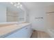 Bathroom featuring a vanity with a sink, large mirror, and light fixture at 179 Moonstone Ct, Port Orange, FL 32129