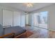 Bright bedroom features wood floors, ceiling fan, closet, and sliding door to balcony at 179 Moonstone Ct, Port Orange, FL 32129