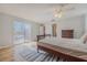 Bedroom with patio access, hardwood floors, and ceiling fan at 179 Moonstone Ct, Port Orange, FL 32129