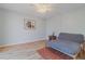 Minimalist bedroom featuring hardwood floors and a futon style bed at 179 Moonstone Ct, Port Orange, FL 32129