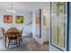Open dining area with a wood table, chairs, and view of the bathroom at 179 Moonstone Ct, Port Orange, FL 32129