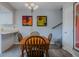 Well-lit dining area showcasing a wooden table and artwork displayed on the walls at 179 Moonstone Ct, Port Orange, FL 32129