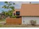 Exterior with brown roof, brick siding, and wooden fence at 179 Moonstone Ct, Port Orange, FL 32129