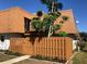 Charming exterior featuring a wooden fence, balcony, and unique roof design at 179 Moonstone Ct, Port Orange, FL 32129