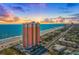 Aerial view of a high-rise condo building on the beach with stunning ocean and city views at sunrise at 1900 N Atlantic Ave # 901, Daytona Beach, FL 32118